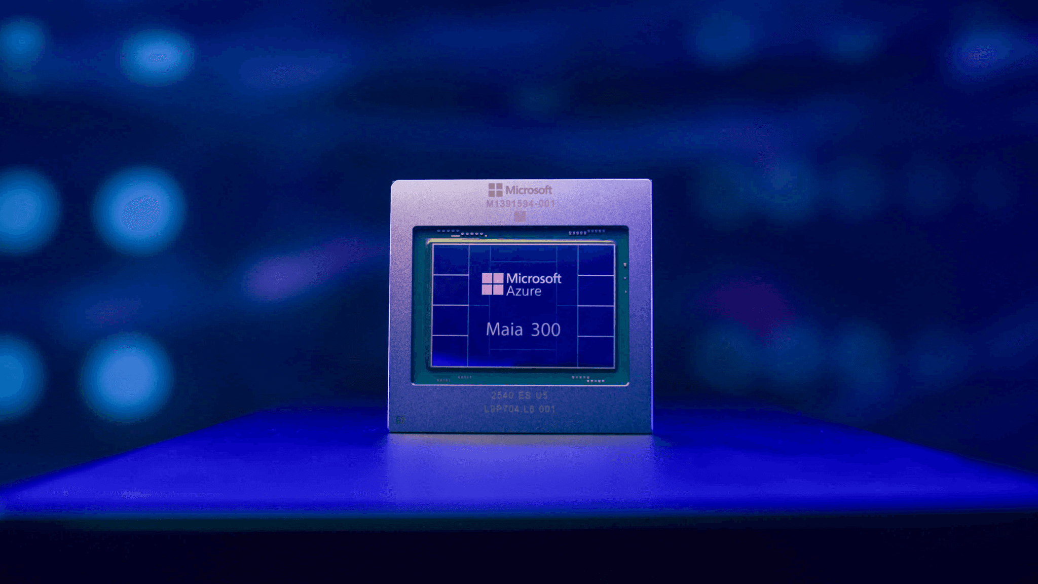Close-up image of a Microsoft Maia 200 processor against a blue background.